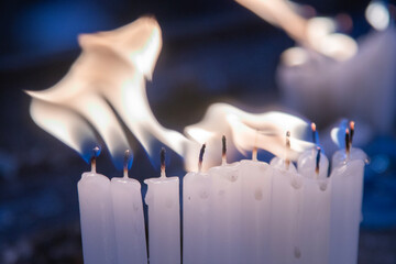 Candles lit together causing a bigger fire