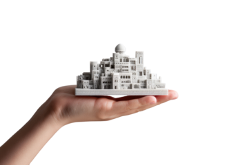 A hand holds a miniature city model