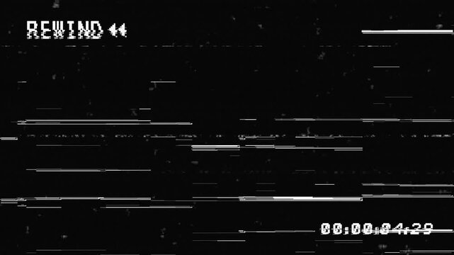 VHS tape rewind glitched on black background. 4K Video