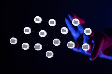 Abstract image of hand interacting with a network of digital files.  Concept for data management, cloud storage, or file