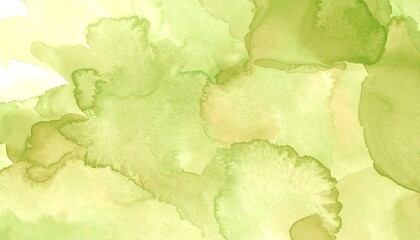 Abstract watercolor splatter in pale green and yellow-beige