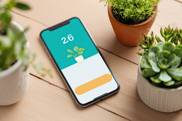 Smart garden app screen mockup displaying plant care information with potted plants