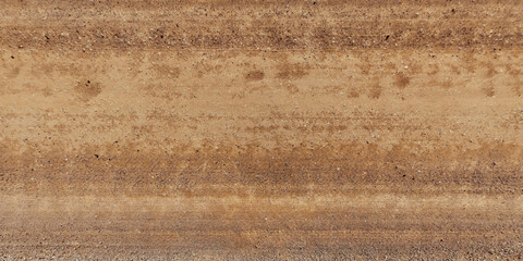 top view of gravel road surface with tractor tire tracks in countryside