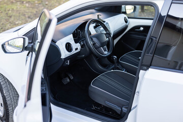 Interior of electric car. Electric car interior. Comfortable seats, dashboard, gearbox control and steering wheel