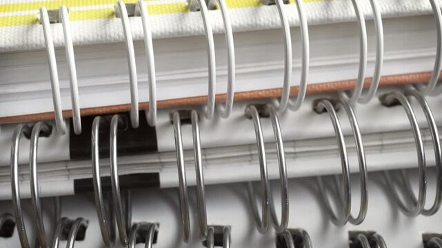 spiral bound note book edge view close up stock footage
