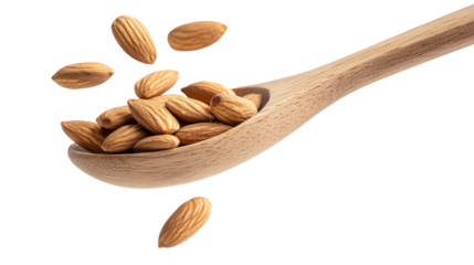 Almond falling from wooden spoon on transparent background