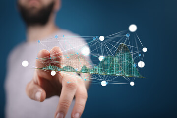 Man interacts with a holographic data visualization, showcasing network connections and growth.