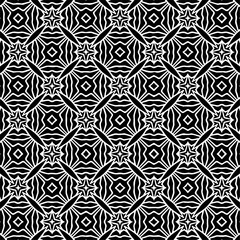 Bold black and white pattern with hexagonal symmetry and intricate geometric shapes.