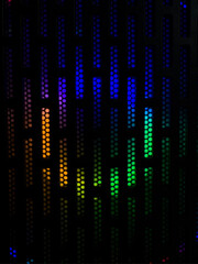 A moody abstract image featuring a dark grid of vertical dot bars illuminated from behind with a soft rainbow gradient. Ideal for tech, digital art, and futuristic backgrounds.