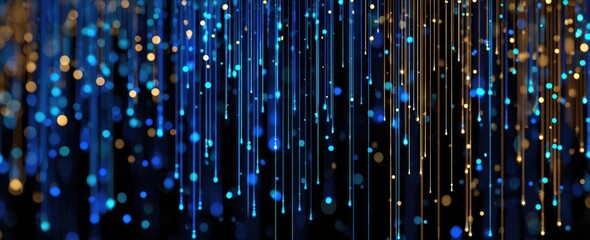 Abstract display of cascading, glowing, vertical lines, punctuated by bokeh