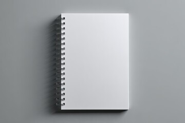 Blank spiral-bound notebook on a gray surface (1)