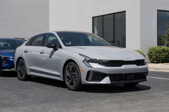 Kia K5 GT-Line AWD sedan display at a dealership. Kia offers the K5 with a 2.5L Direct Injection engine. MY:2025