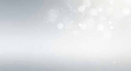 Obraz premium Abstract light background with soft bokeh effect and shiny glitter spots creating a festive and elegant atmosphere