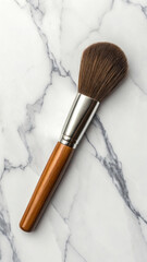 Highquality makeup brush with wooden handle and metal ferrule on a marble surface