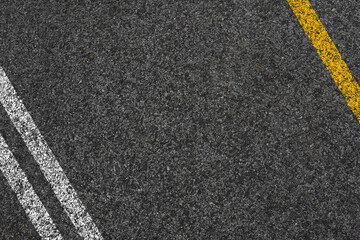 Fototapeta premium Double Yellow Line On New Asphalt Road texture background