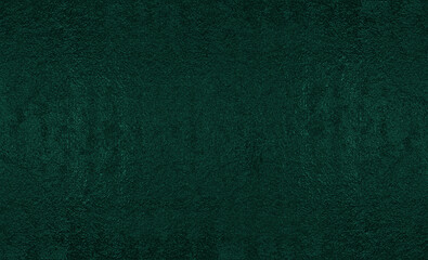 Dark green texture with rough finish and deep tone, ideal as elegant background or visual asset for graphic design.