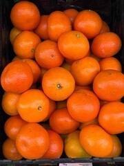 Fresh Oranges in a Display Basket at Market