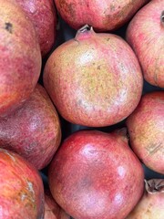 Close-Up of Fresh Ripe Pomegranates with Vibrant Colors on Display
