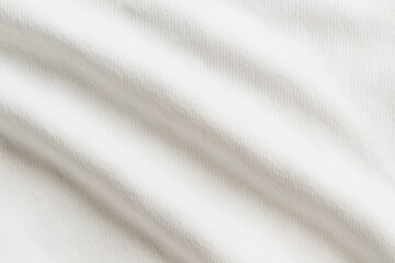 Fototapeta premium The subtle interplay of light and shadow on a white fabric surface