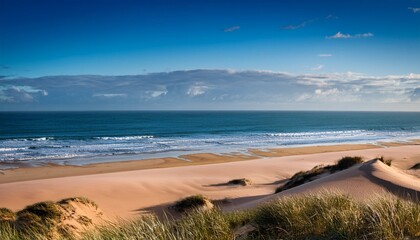 a breathtaking masterpiece showcasing harmonious convergence of sand dunes and mighty ocean where vibrant coastal front dances with boundless energy and tranquil union of land and sea creates a spec
