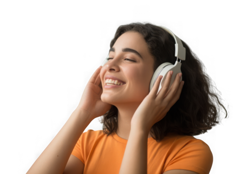 Joyful young woman listening to music with headphones