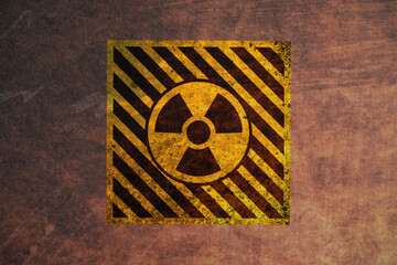 Obraz premium Radioactive sign on brown textured background, banner design. Radiological pollution