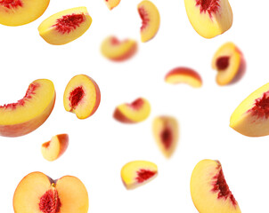 Fresh peaches whirling in air against white background