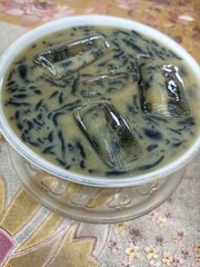 Black dawet ice in a bowl on a abstract background