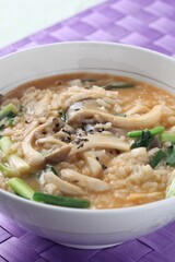 Korean clam and mushroom porridge in soybean broth with Enutari mushrooms. Dish by Master Chef Hans Chunseop.