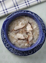 Korean mushroom porridge with assorted mushrooms and Omija flavor. Dish by Master Chef Hans Chunseop.