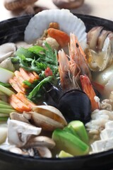Hearty mushroom and seafood jeongol with oyster mushrooms and tofu. Korean hot pot by Master Chef Hans Chunseop.
