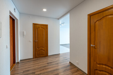 Home Entrance Hall. Interior. Wooden Outdoor Door, Brown Flooring.