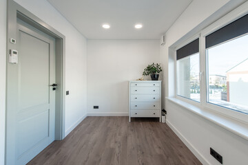 Home office room interior. Wooden Floor, Windows, Door. Bright White Color Walls and Ceiling.