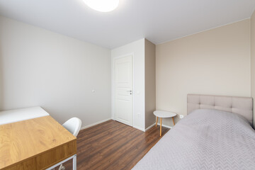 Minimalism Children, Young Adult Living Room Interior. Gray Blanket on the Bed.
