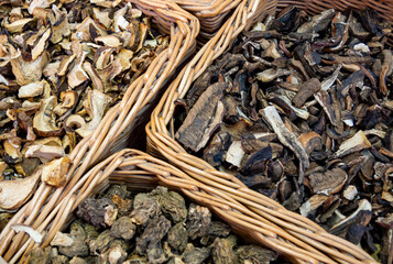 Wicker baskets with different types of dried mushrooms