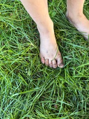 The feeling of the earth: barefoot in the grass
