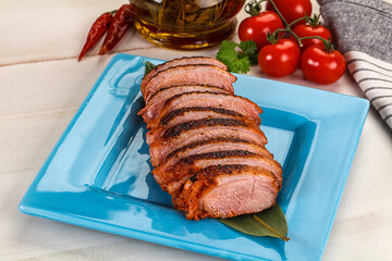 Sliced duck breast baked with cherry