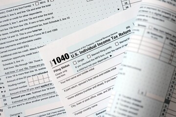 1040 US individual income tax return form blank close up. Few pages of united states tax blank