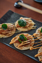 Deliciously Crafted Tacos with Unique Toppings and Sauces on a Stylish Serving Plate, Showcasing Culinary Artistry and Flavorful Combinations