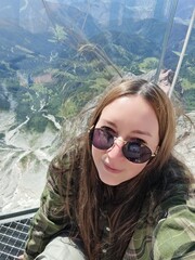 Smiling Woman Taking a Selfie with a Mountain View