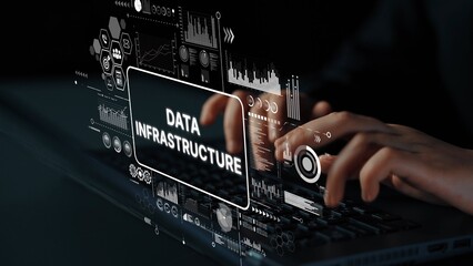 Hands Typing on Laptop with Futuristic Data Infrastructure Graphic Overlay and Digital Elements. Asymptotic smart data analytic.
