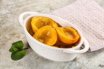 Canned marinated peach in syrop