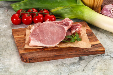 Raw pork steak loin with bone