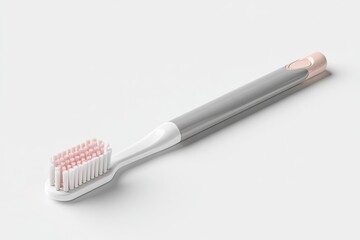 Gray and white toothbrush angled on white background.  Pink bristles