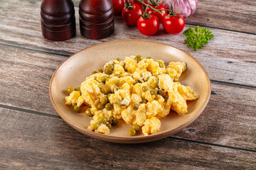 Scrambled egg omelet with green peas