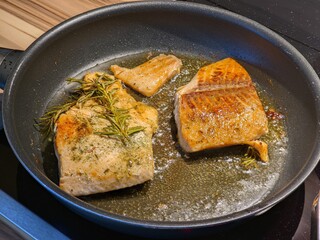 Freshly Cooked Salmon Fillets with Rosemary in a Pan, Ready to Serve