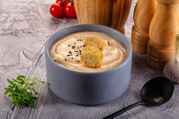 Tasty cheese cream soup with crouton
