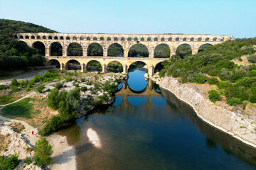 Naklejka premium Pont du Gard, ancient Roman aqueduct bridge built in the first century AD crossing river Gardon in southern France, a world heritage site