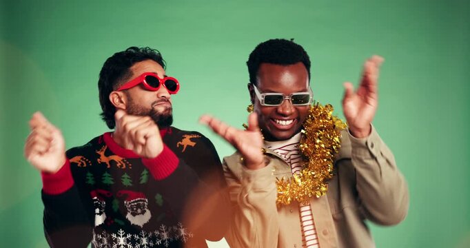Dance, Christmas and friends or men in studio for holiday season, party and festive event. Happiness, xmas vacation and energy with people on green background for December, celebration and bokeh