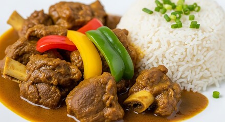 Close up of a plate with meat curry, rice and colorful bell pepper slices